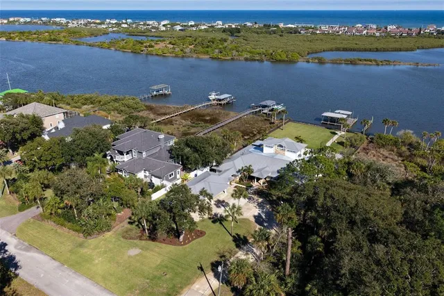 a view of a patio with table and chairs potted plants