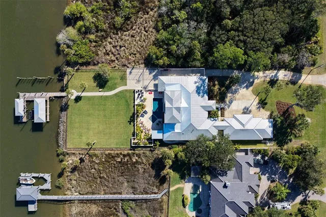 a view of a house with yard and sitting area