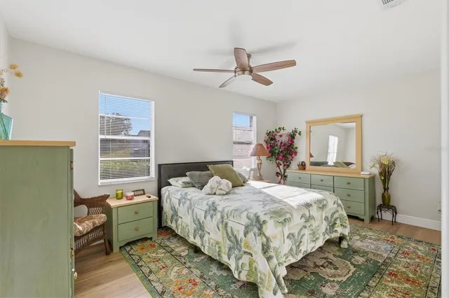 a bedroom with a bed and a table