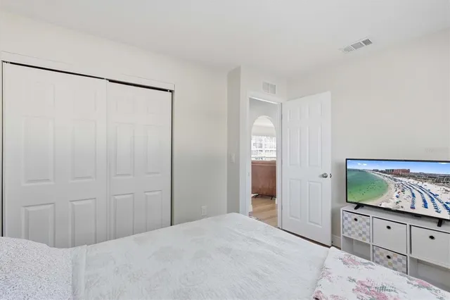 a bedroom with a bed and a dresser