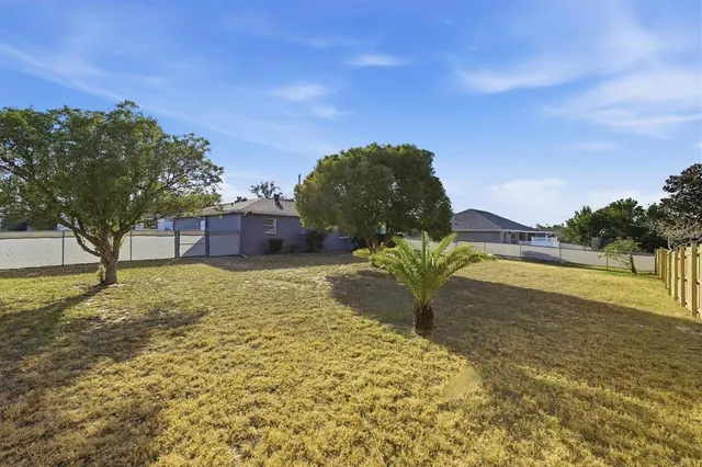 a swimming pool with trees in the background