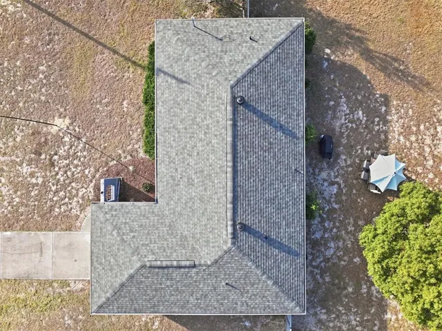 a view of a brick house with a yard