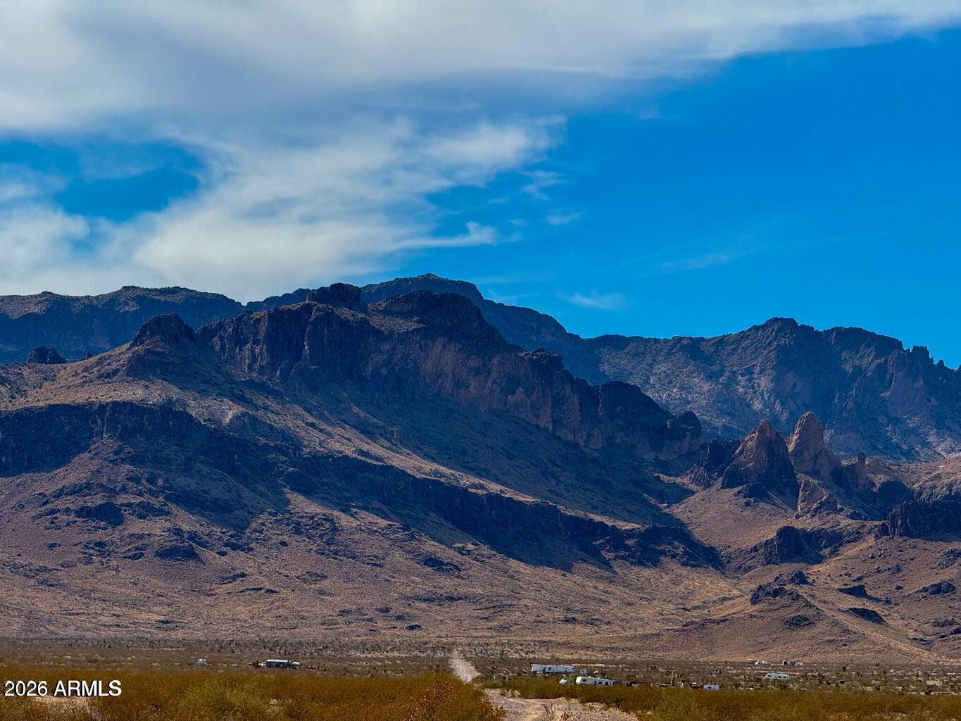 0 West Wingate Golden Valley, AZ 86413 - Photo 16 of 19 a view of a backyard with wooden fence