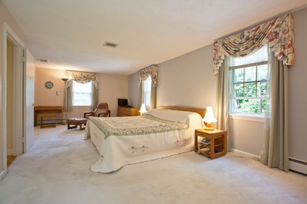 18 Chatham Way Lynnfield, MA 01940 - Photo 12 of 28 a spacious bedroom with a bed and a window