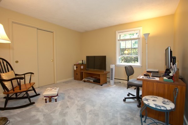18 Chatham Way Lynnfield, MA 01940 - Photo 13 of 28 a view of a workspace with furniture and a window
