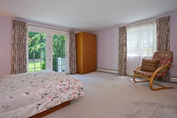 18 Chatham Way Lynnfield, MA 01940 - Photo 16 of 28 a bedroom with a bed and a chair