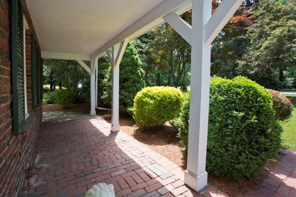 18 Chatham Way Lynnfield, MA 01940 - Photo 26 of 28 a view of a porch with furniture and garden