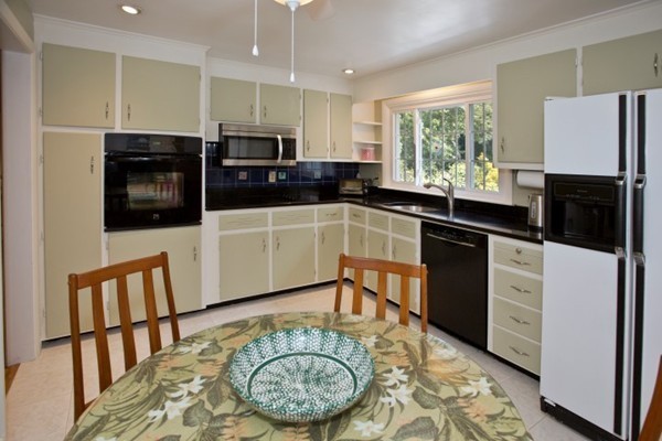 18 Chatham Way Lynnfield, MA 01940 - Photo 9 of 28 a kitchen with stainless steel appliances granite countertop a stove a sink and a microwave
