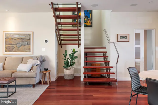 a kitchen with stainless steel appliances granite countertop a stove a sink and a white cabinets