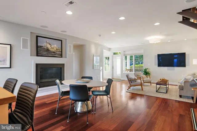 a large kitchen with stainless steel appliances granite countertop a large counter top and a stove top oven