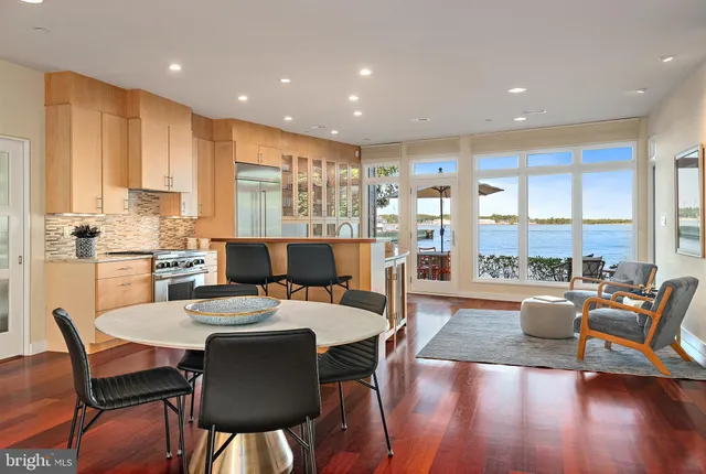 a kitchen with stainless steel appliances a stove a sink and a refrigerator