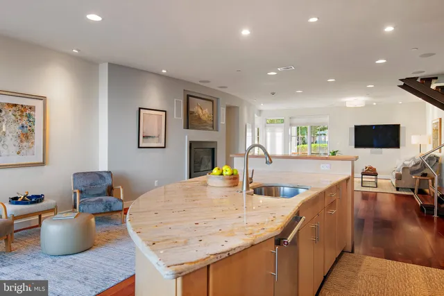a view of a hallway with paintings on the wall