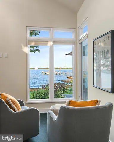 a bedroom with a large bed and a flat screen tv