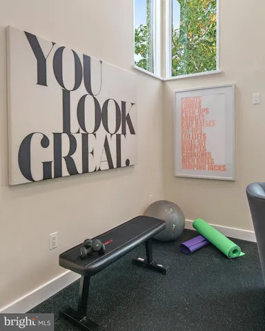a white bath tub sitting next to a white sink