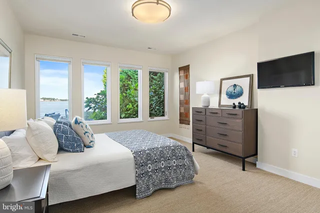 a view of a workspace with furniture and wooden floor