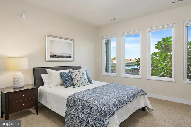 a bedroom with bed and a window