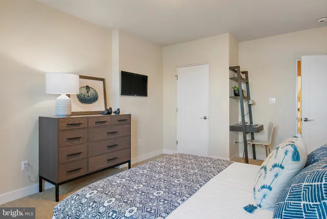 a view of a lake with a floor to ceiling window next to a city view