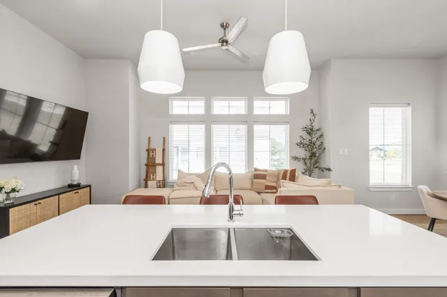 a view of living room with granite countertop furniture and fireplace