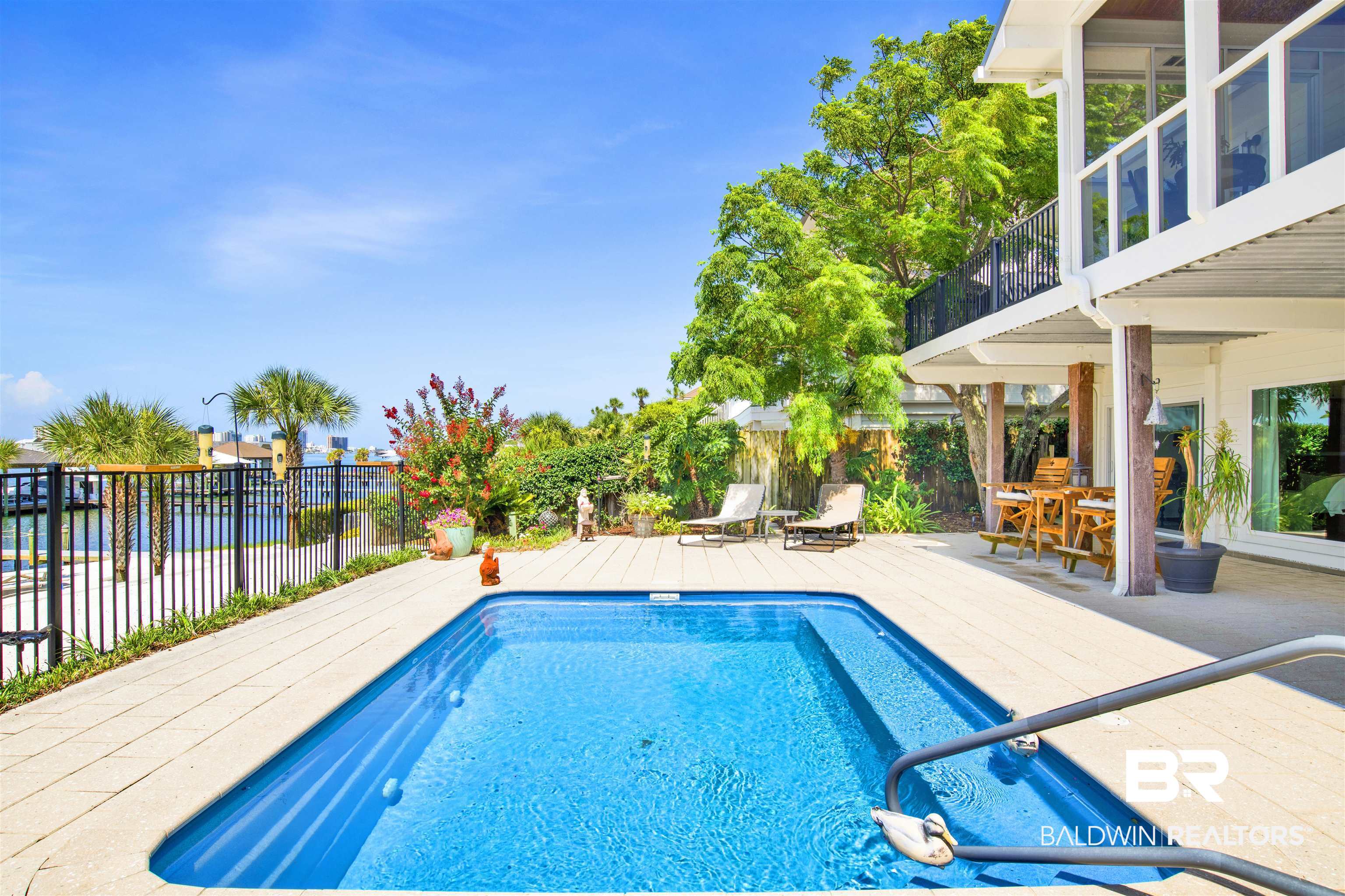 30538 River Road Orange Beach, AL 36561 - Photo 59 of 78 View of pool featuring a deck and outdoor dining area