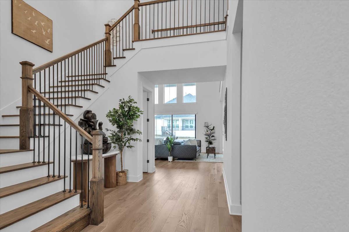2312 Mondello Path Leander, TX 78641 - Photo 26 of 40 Entryway featuring a high ceiling and light wood-style flooring