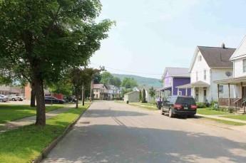 107 Buchanan Street Warren, PA 16365 - Photo 3 of 3 a city street lined with tall buildings