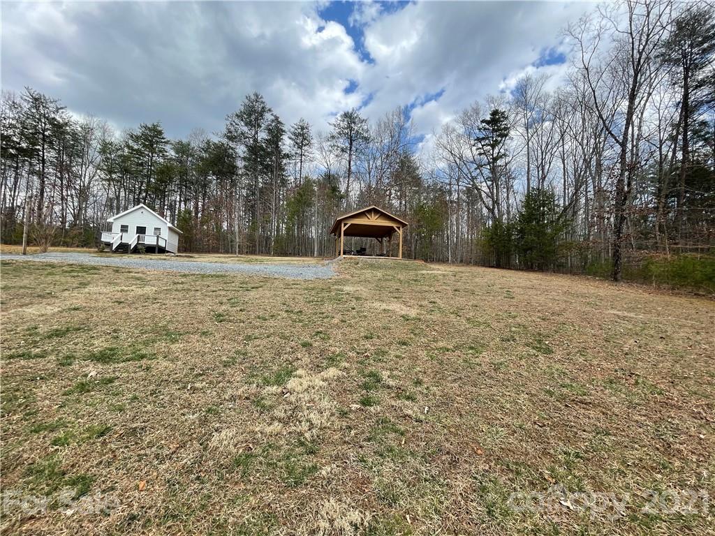 770 Padgett Road Union Mills, NC 28167 - Photo 25 of 48 a big yard with lots of tress in front of it
