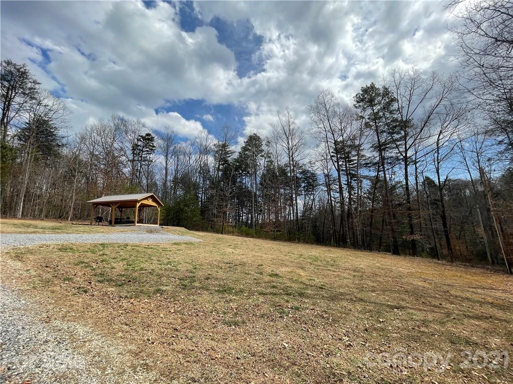 770 Padgett Road Union Mills, NC 28167 - Photo 29 of 48 a backyard of a house with large trees