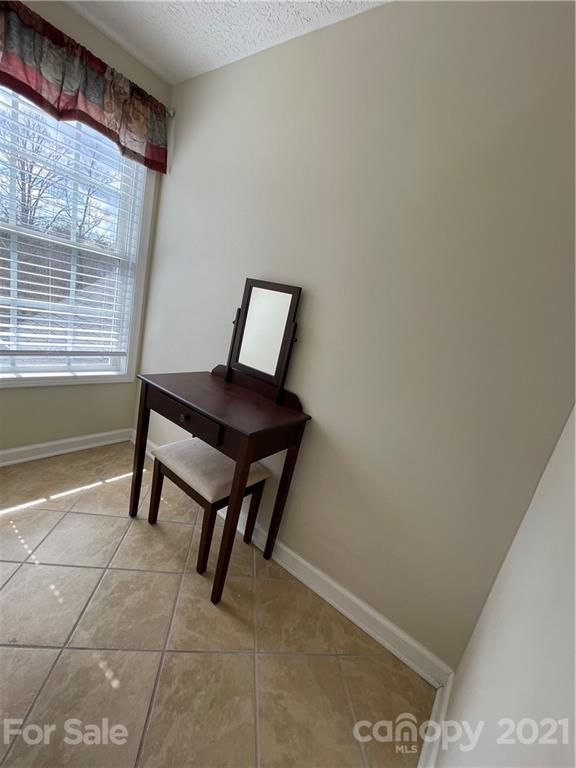 770 Padgett Road Union Mills, NC 28167 - Photo 35 of 48 a view of a room that has a bench and chair
