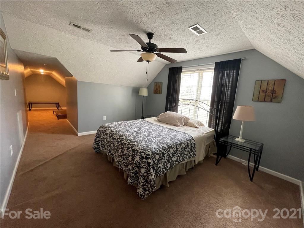 770 Padgett Road Union Mills, NC 28167 - Photo 43 of 48 a bedroom with a bed and a mirror