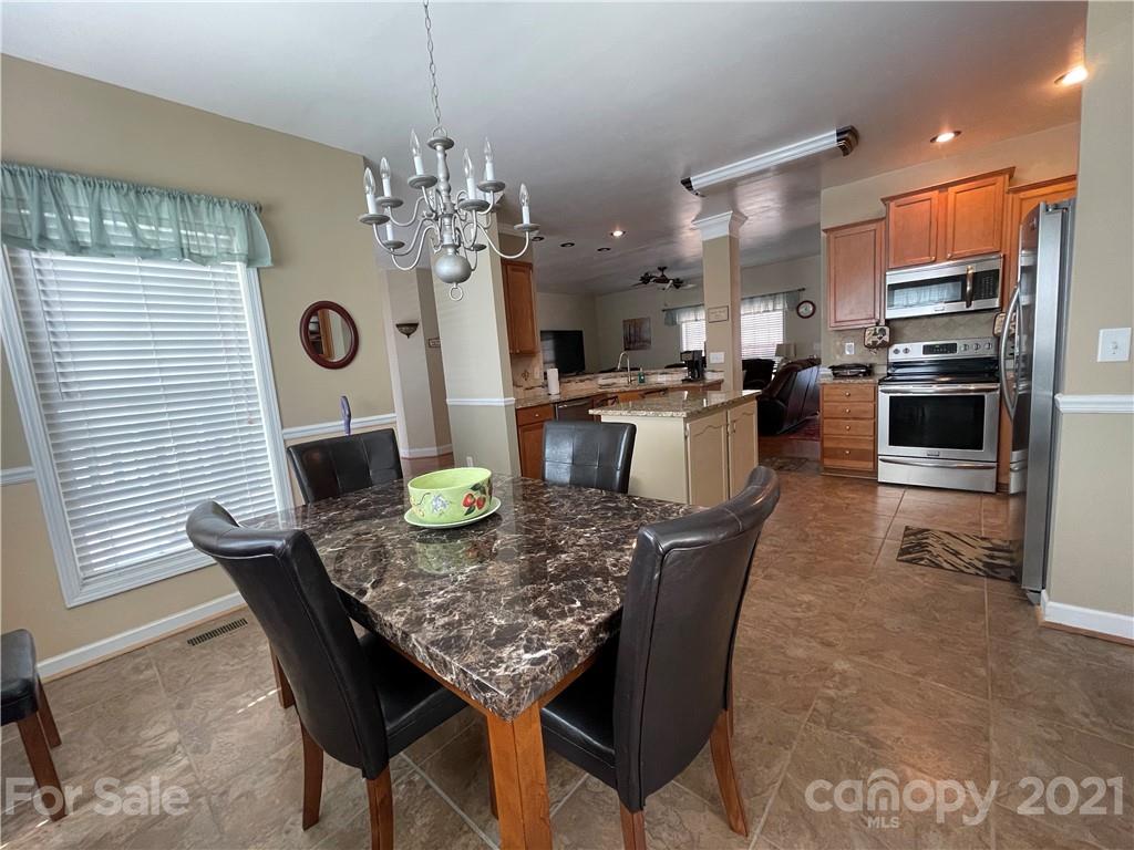 770 Padgett Road Union Mills, NC 28167 - Photo 6 of 48 a kitchen with a table and chairs in it