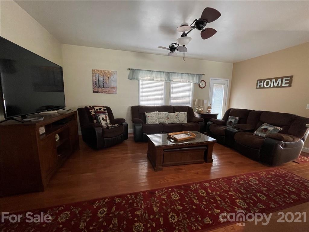 770 Padgett Road Union Mills, NC 28167 - Photo 8 of 48 a living room with furniture and a flat screen tv