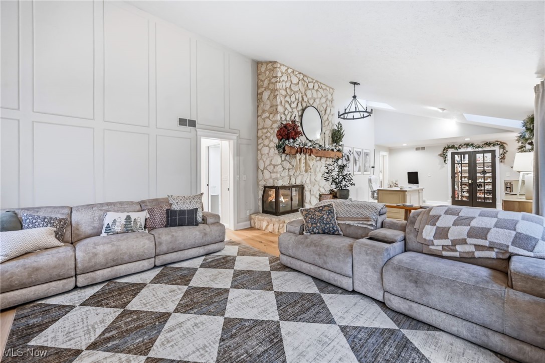 264 Pheasant Run Road Southeast Warren, OH 44484 - Photo 16 of 42 Family room with cathedral ceilings and brick fireplace