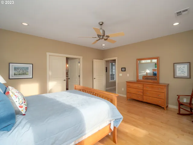 a bathroom with a granite countertop tub sink and mirror