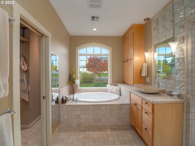 a bathroom with a shower and a sink