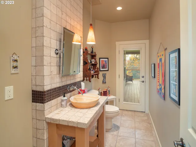 a utility room with cabinets washer and dryer
