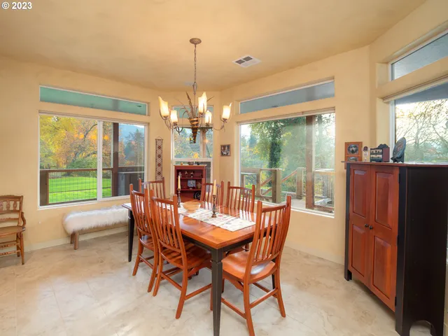 a bed room with a bed and a large window
