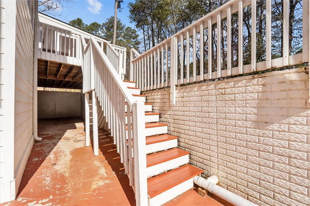 1030 Lakeview Parkway Villa Rica, GA 30180 - Photo 40 of 46 a view of a balcony with wooden floor and fence