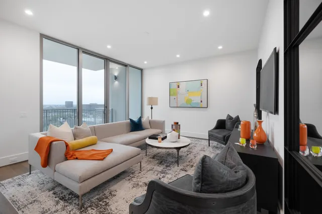 a kitchen with a white cabinets sink and stove