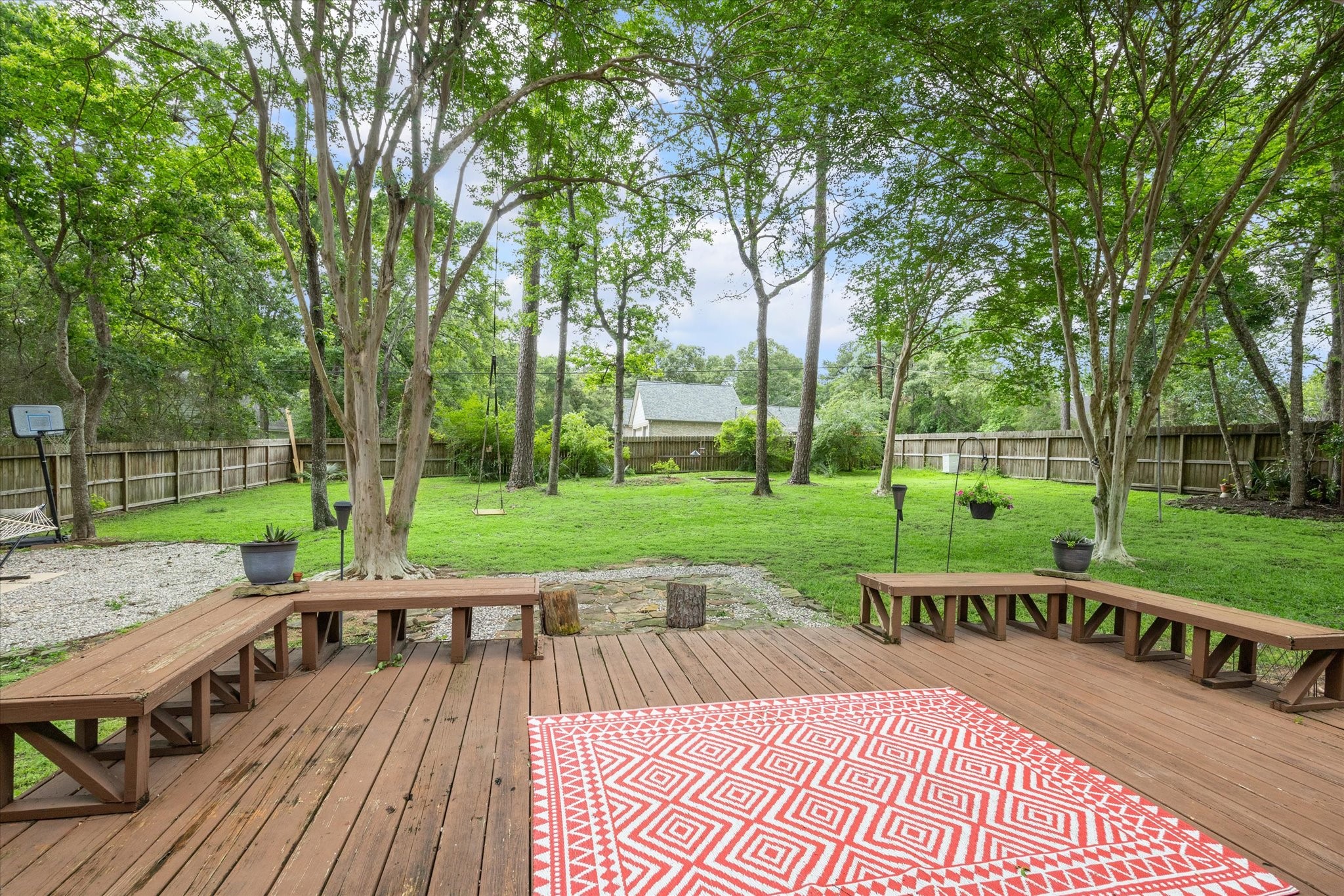 2420 Canter Lane Conroe, TX 77384 - Photo 2 of 24 a view of a table and chairs on the roof deck