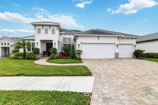 a front view of a house with a yard and garage