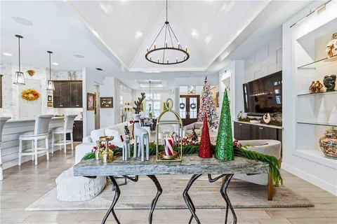 a bedroom with a bed and painting on the wall