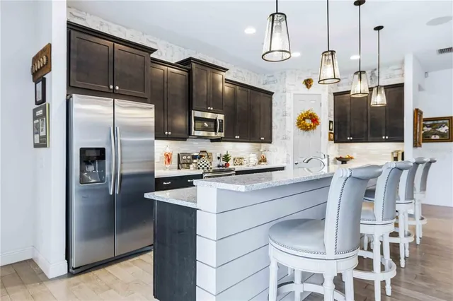 a bedroom with a bed and ceiling fan