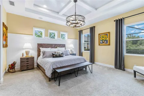 a spacious bathroom with a double vanity sink and a mirror