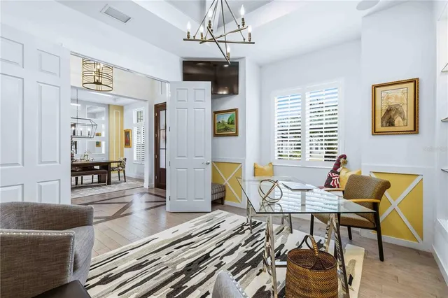 a kitchen with stainless steel appliances kitchen island granite countertop a table and chairs in it