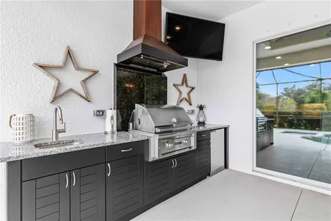 an aerial view of multiple houses with a big yard