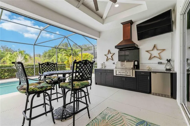 an aerial view of a house with swimming pool and garden