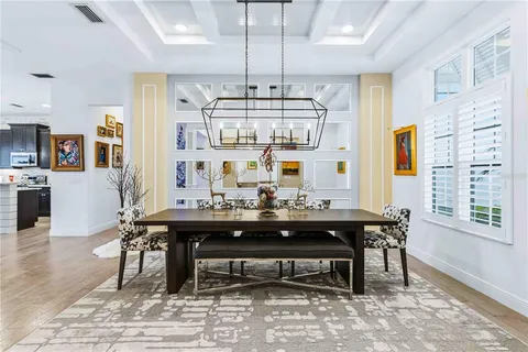 a view of a livingroom with furniture window and wooden floor