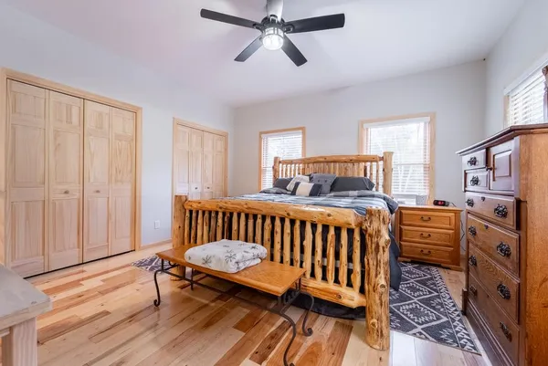 a bedroom with furniture and a window