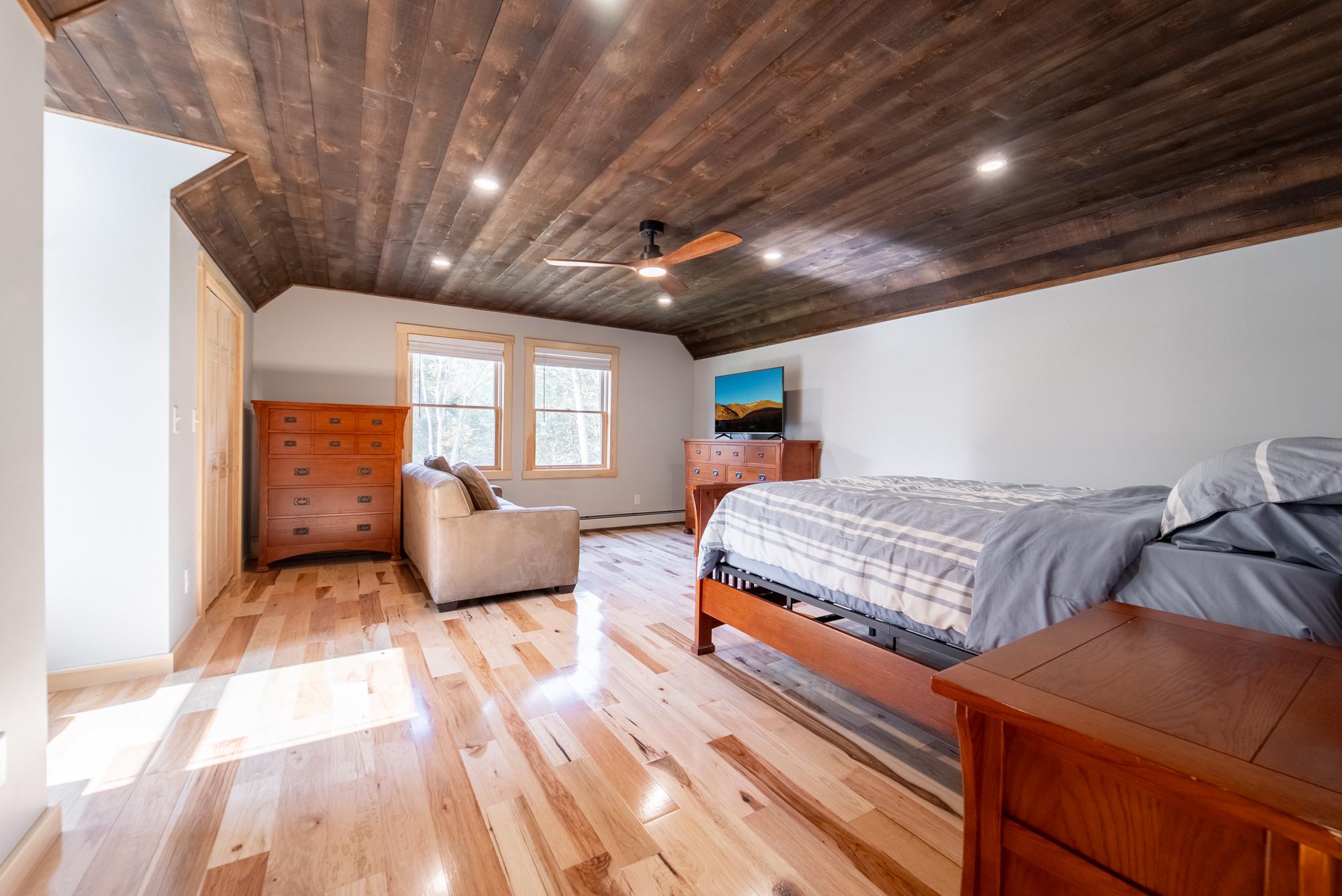 45 Campbell Mountain Road Downsville, NY 13755 - Photo 30 of 34 a bedroom with a bed and wooden floor