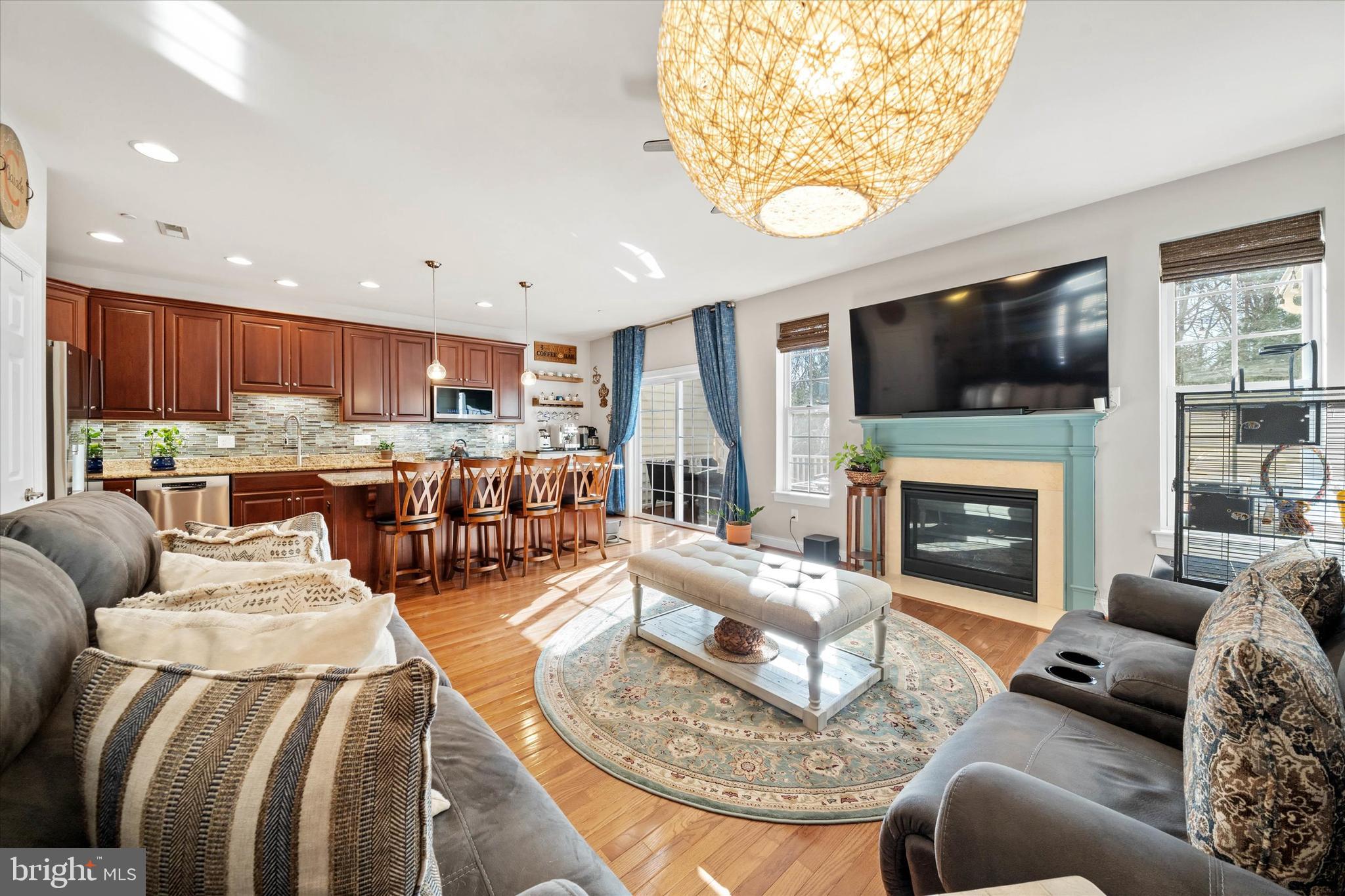 264 Deepdale Drive, Unit 31 Kennett Square, PA 19348 - Photo 12 of 34 a living room with fireplace furniture and a flat screen tv